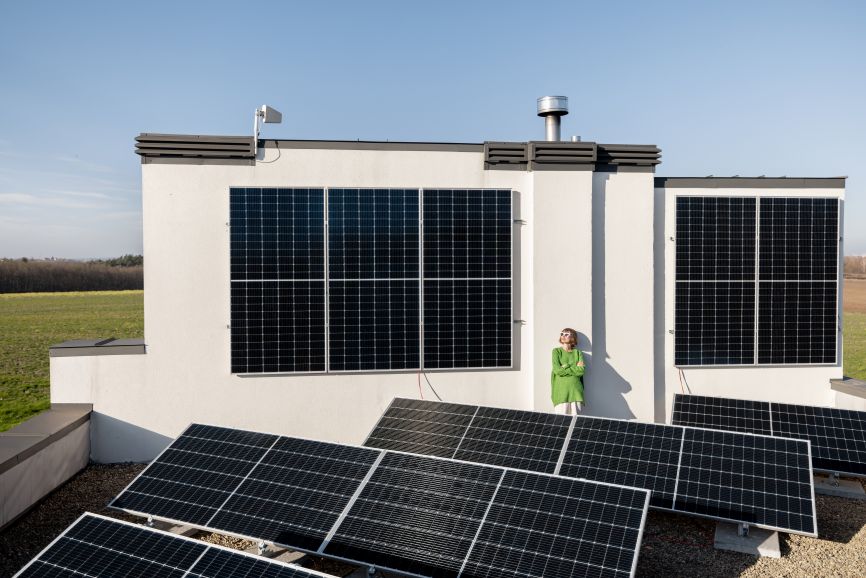 Black solar panels installed on a modern home by EcoSunWorks