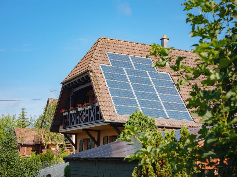 Residential off grid solar home showing solar panel size and dimensions on sloped roof by Eco Sun Works