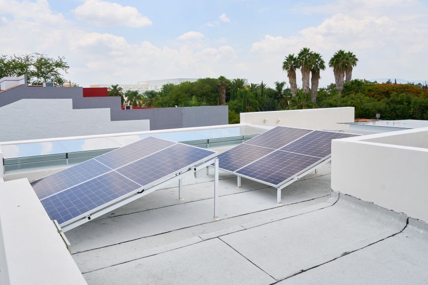 Solar panels installed on a flat roof – Can You Install Solar Panels on a Flat Roof? by Eco Sun Works