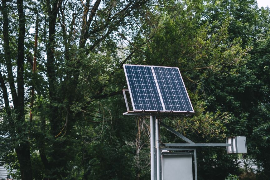 Automated solar panels in a green outdoor setting by EcoSunWorks