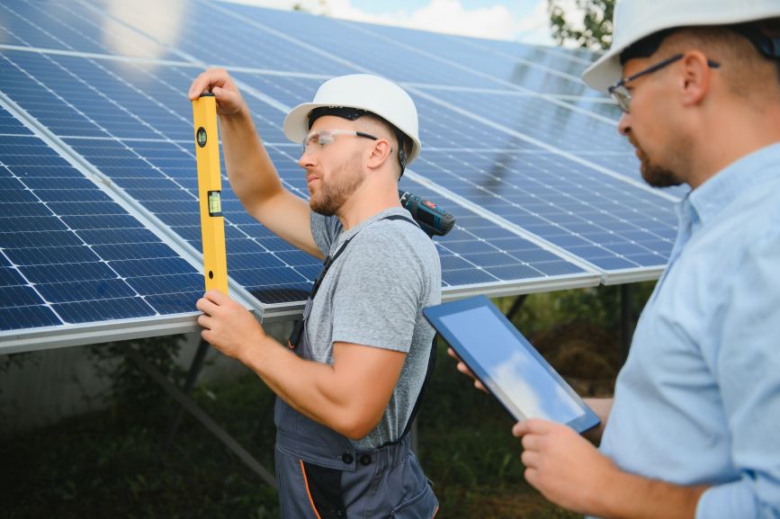 EcoSun Works technicians adjusting the best orientation for solar panels during installation