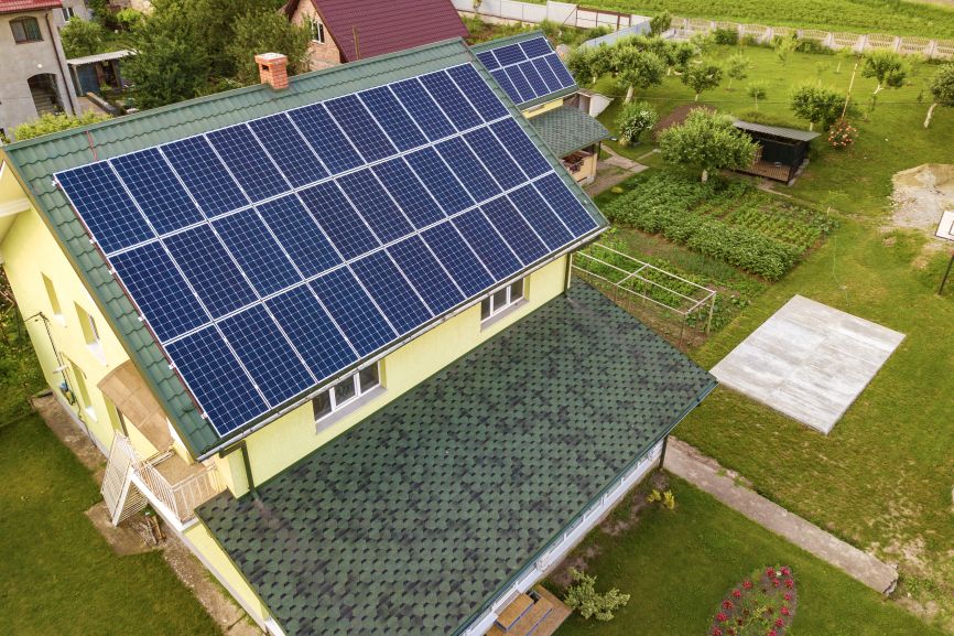 Aerial view of a Massachusetts home featuring an EcoSunWorks solar panel system without battery.