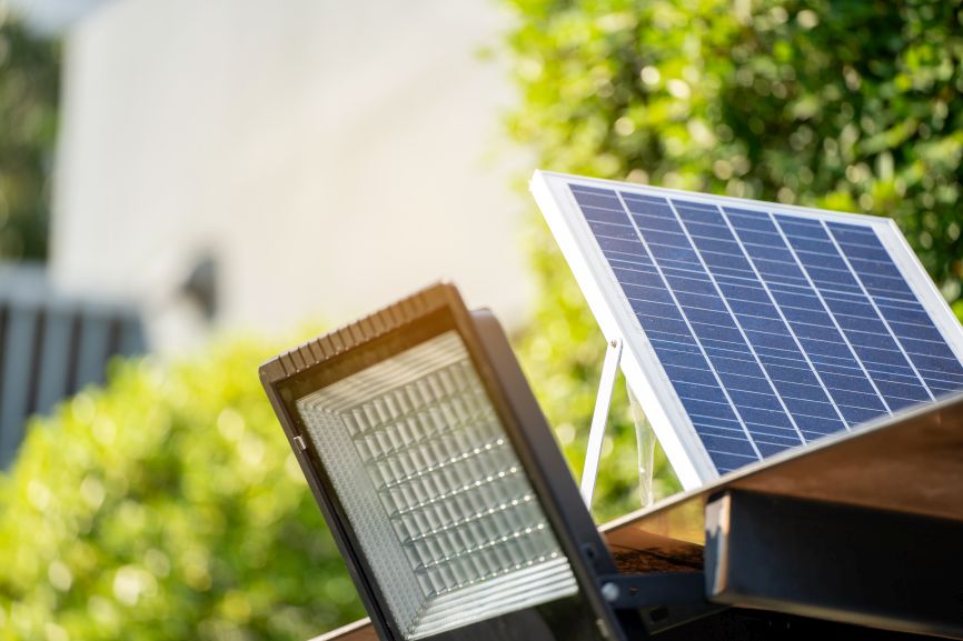 EcoSunWorks solar panels and power outage solution with outdoor solar light in sunlight.